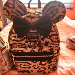 Loungefly Animal kingdom Cheetah print bag.